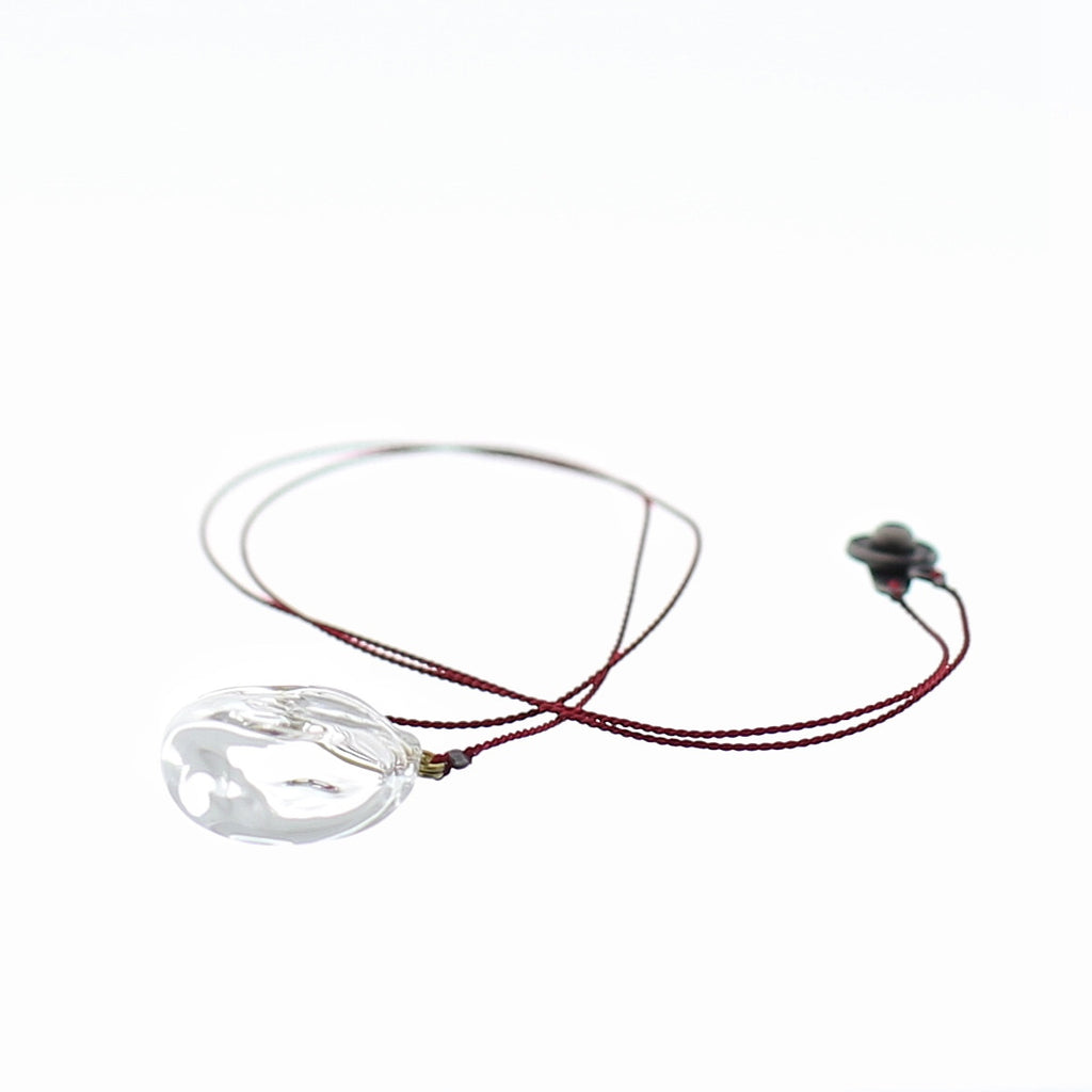 Close up of Air Bubble Pendant - Round Rose Red Glass Neckless with Silk Thread Made in Japan
