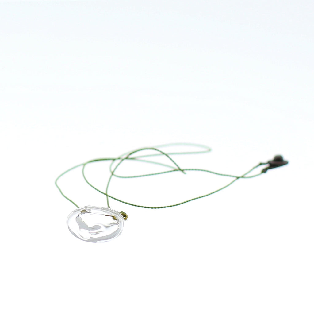 Close up of Air Bubble Pendant - Round Spring Leaf Green Glass Neckless with Silk Thread Made in Japan